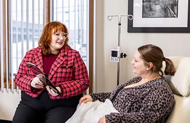 Patient being shown information about infusion treatments