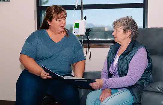 Nurse with Female Patient showing her a chart