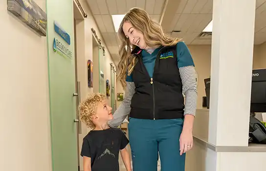 Nurse helping child at Big Sky IV Care