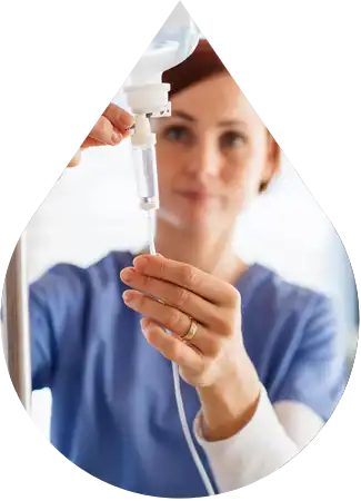 Nurse checking an infusion therapy IV